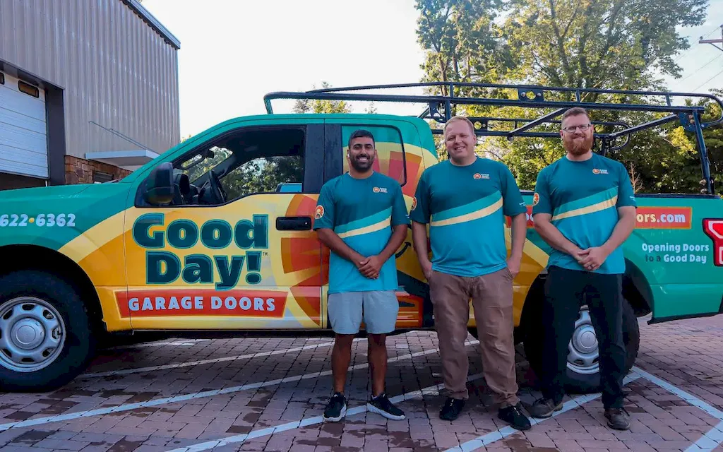 Good Day Garage Doors team standing with service vehicle in Knoxville